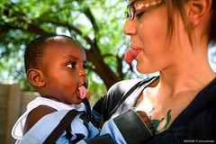 woman and child sticking tongue out